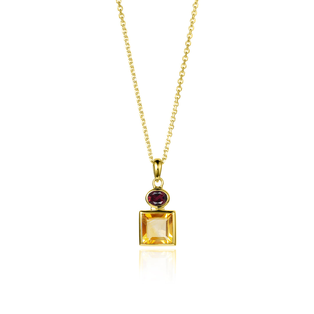 Gold necklace with a pendant featuring a square citrine gemstone and oval garnet stone on a white background