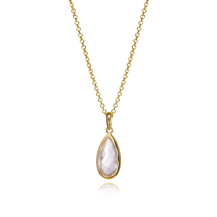 Gold teardrop shaped pendant with a pale rose quartz gemstone and chain on a white background.