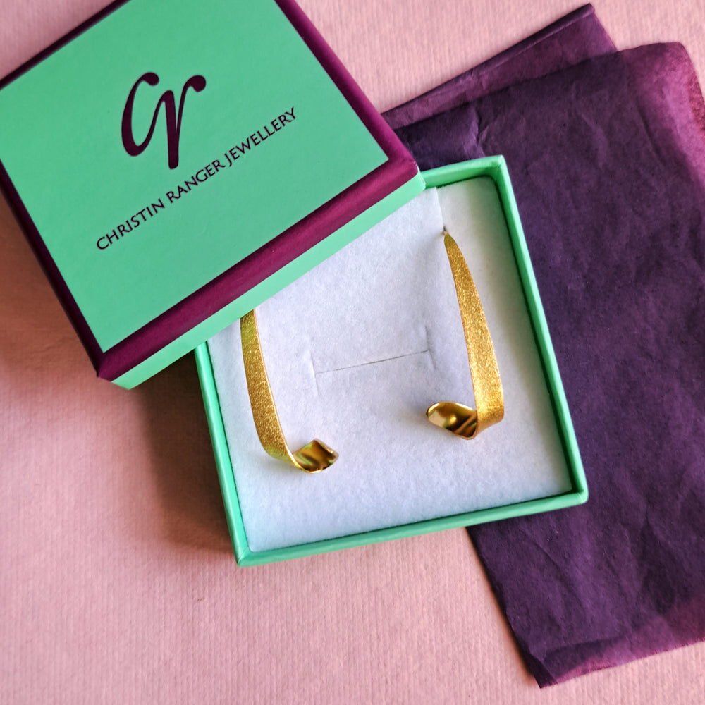 Gold vermeil swirl threader hoop earrings in Christin Ranger Jewellery  gift packaging