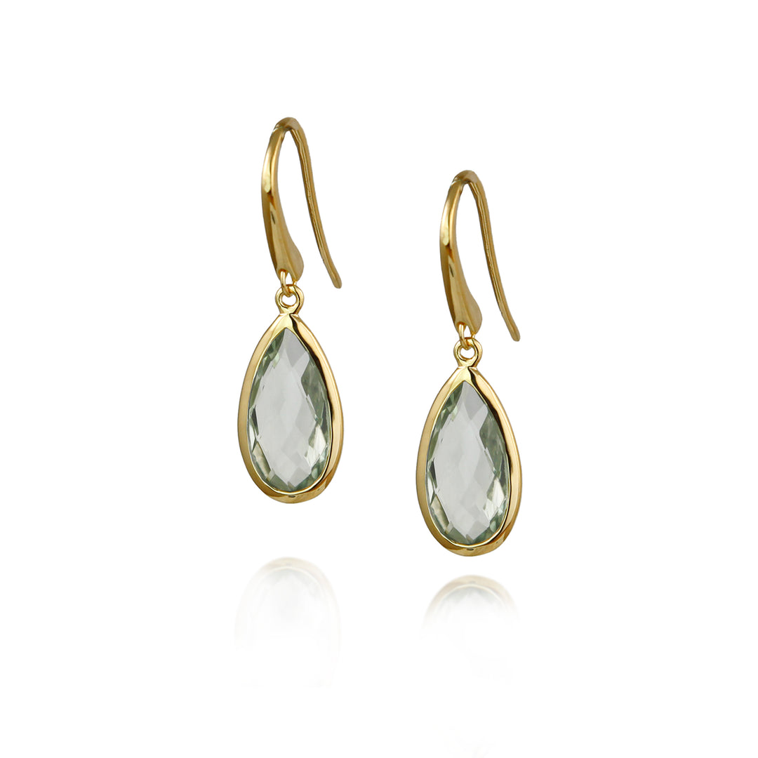Gold earrings with pale green teardrop-shaped amethyst  gemstones on a white background