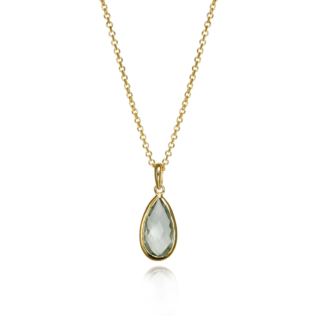Gold necklace with a teardrop-shaped pendant set with a pale green amethyst  gemstone on a white background