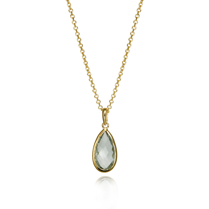 Gold necklace with a teardrop-shaped pendant set with a pale green amethyst  gemstone on a white background