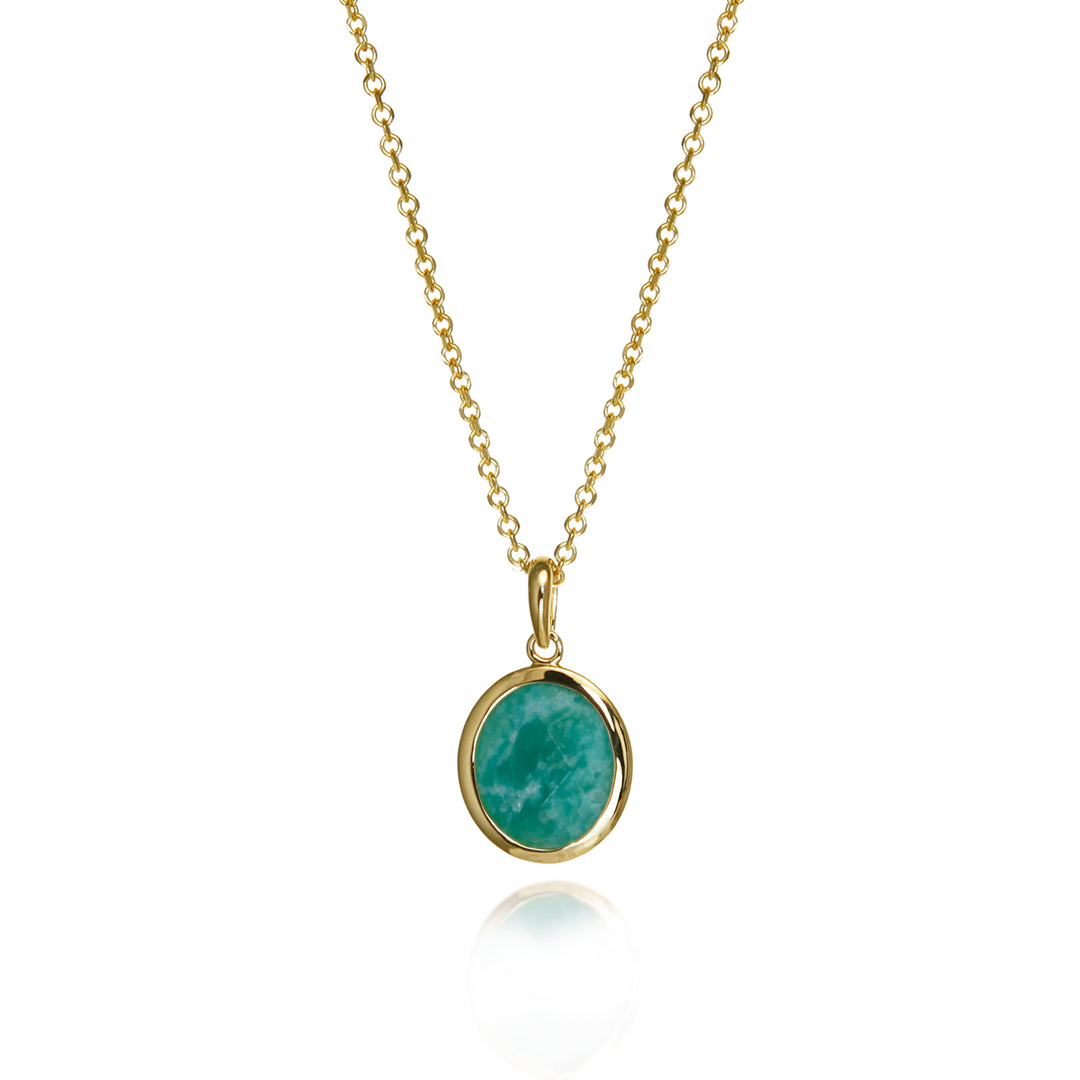 Gold amazonite necklace with a green gemstone on a white background