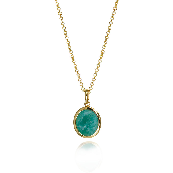 Gold amazonite necklace with a green gemstone on a white background
