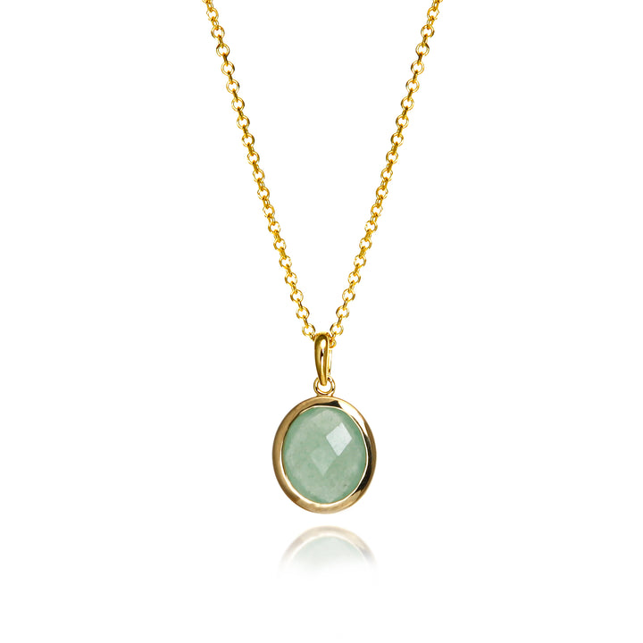 Gold aventurine necklace with a green gemstone on a white background