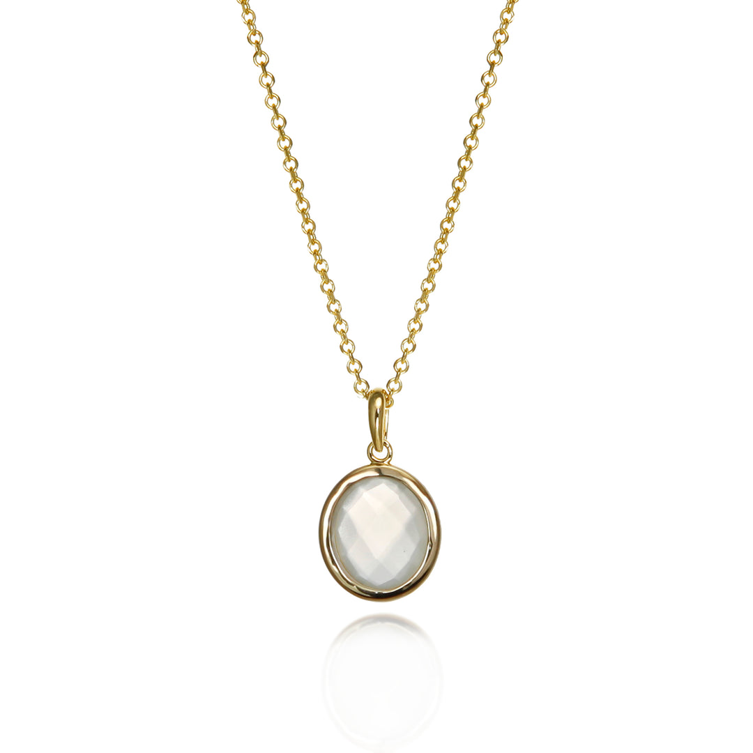 Gold moonstone necklace with a white gemstone on a white background
