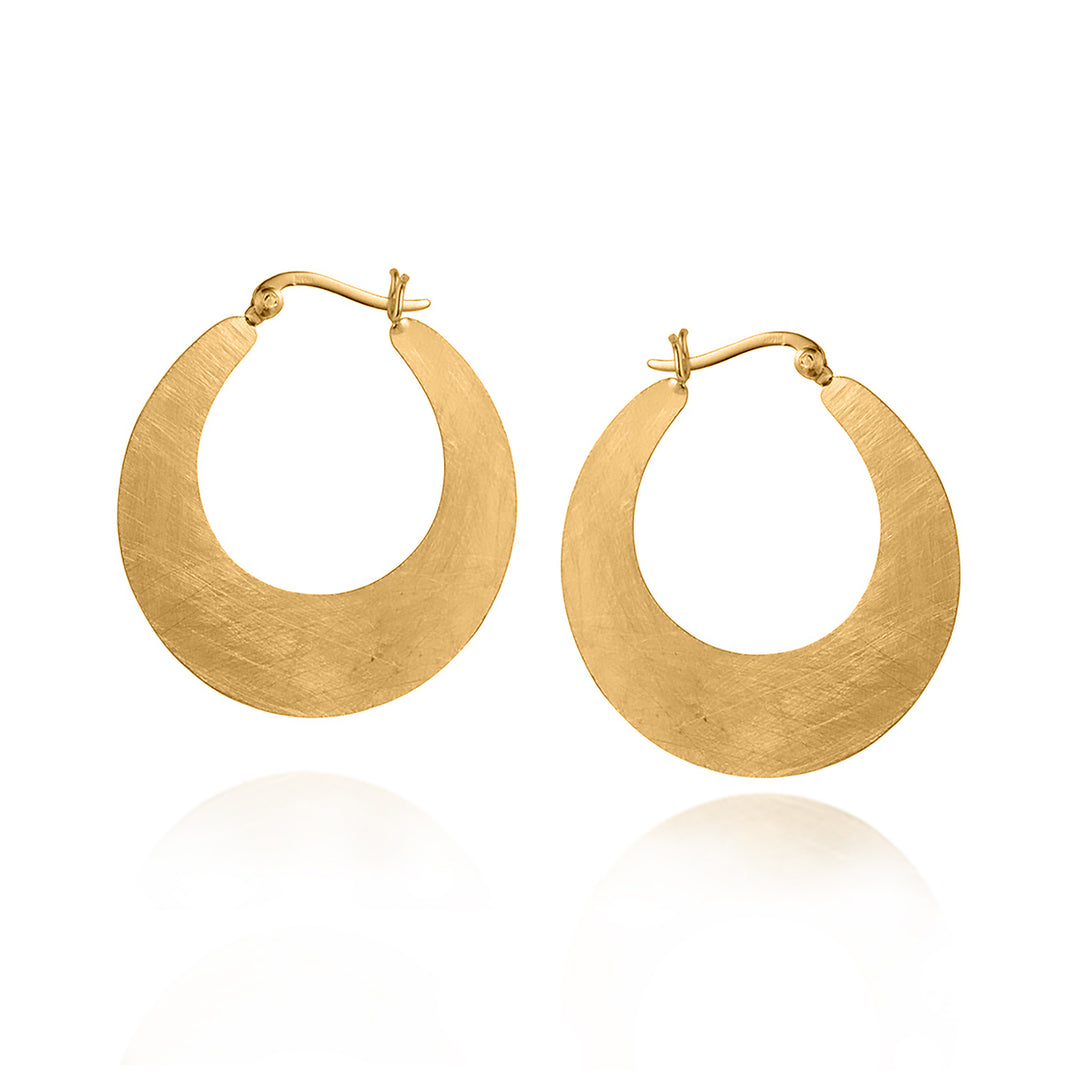 Gold hoop earrings on a white background