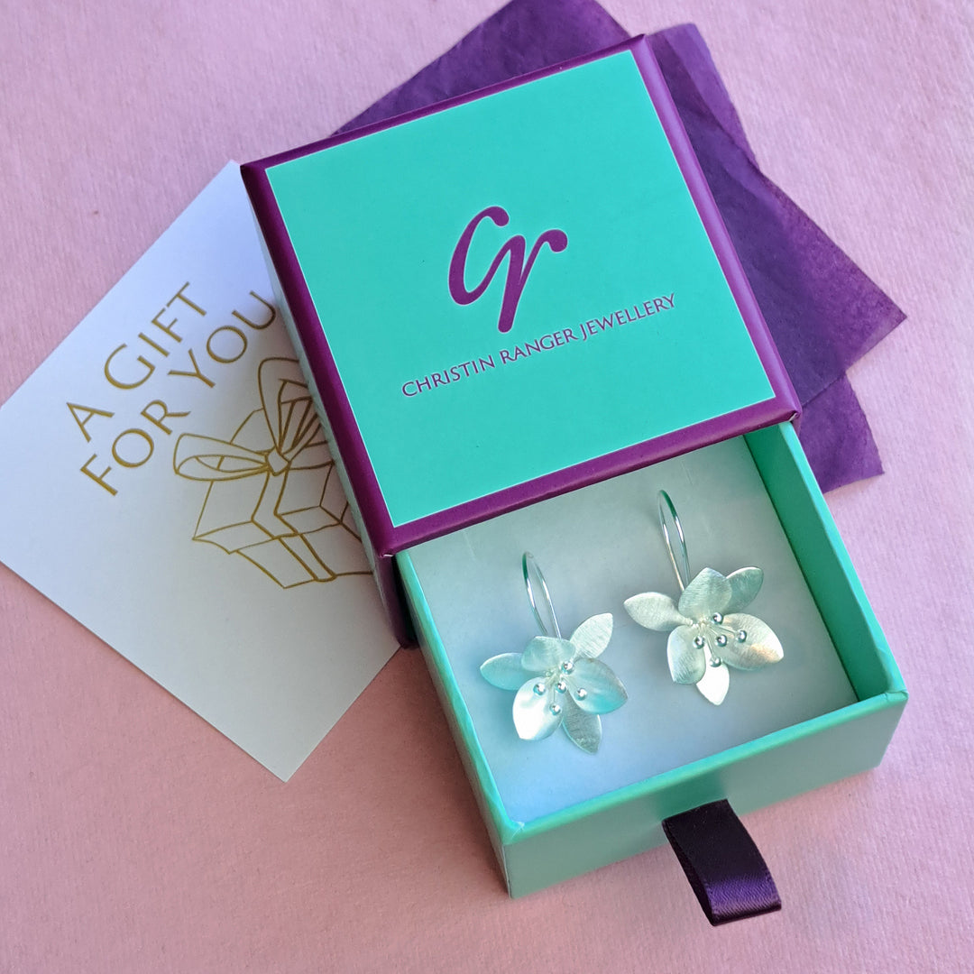 Sterling silver orange blossom threader earrings in Christin Ranger gift packaging
