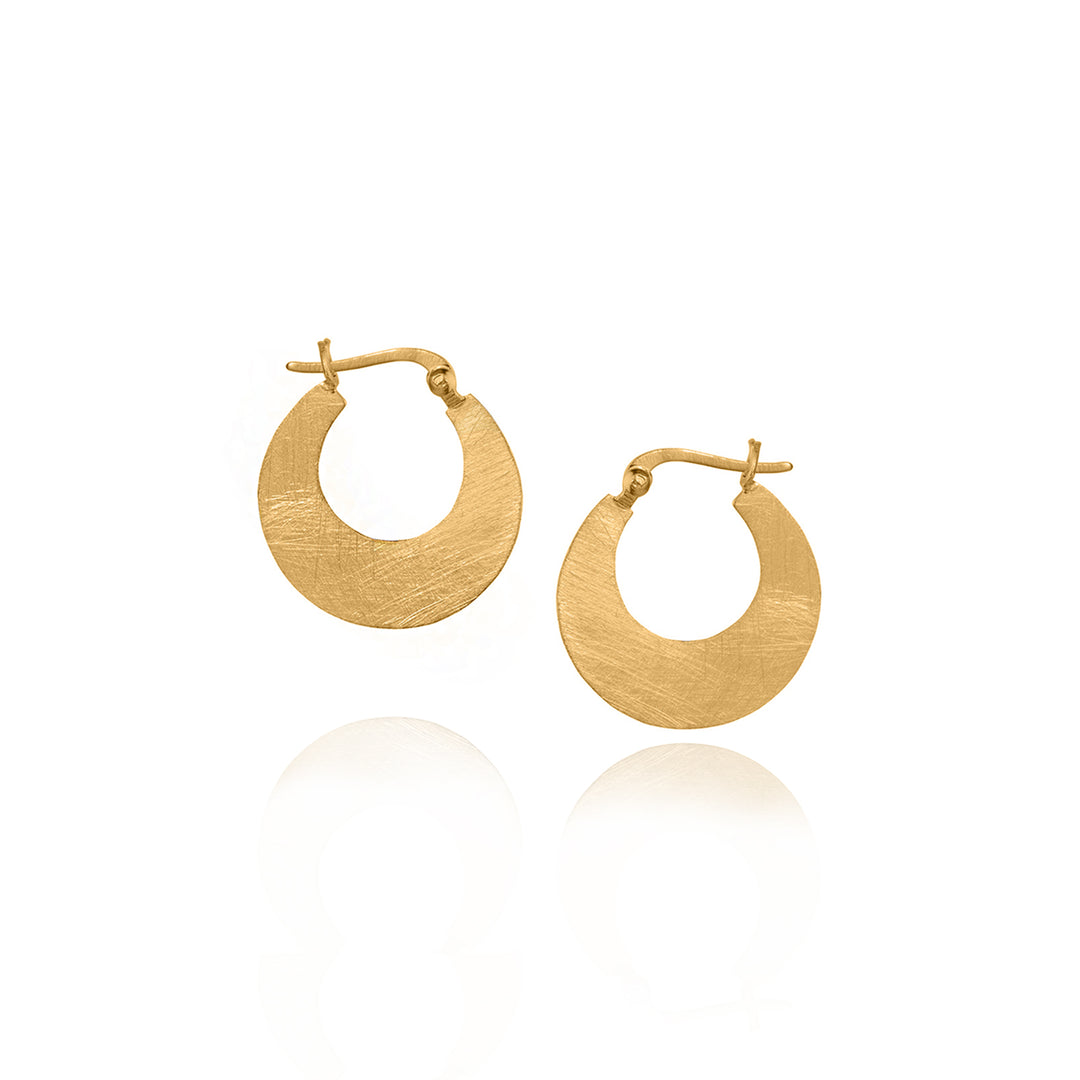 Gold hoop earrings on a white background