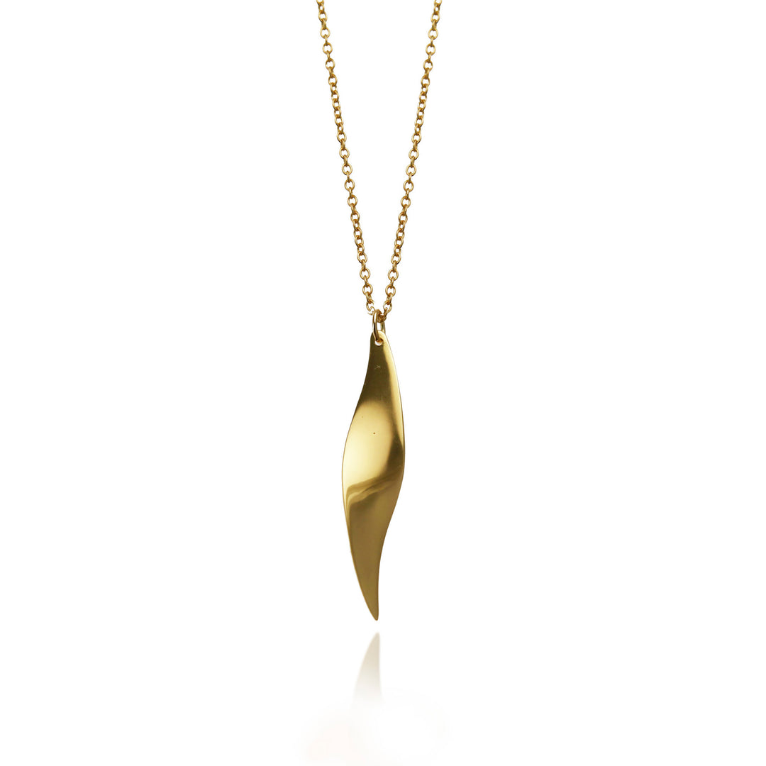 Shiny gold pendant necklace on a white background
