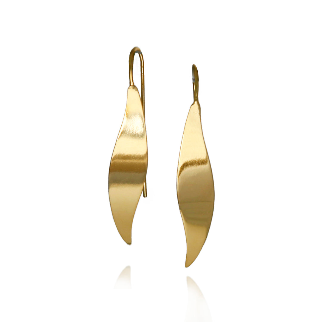 Polished gold threader earrings on a white background