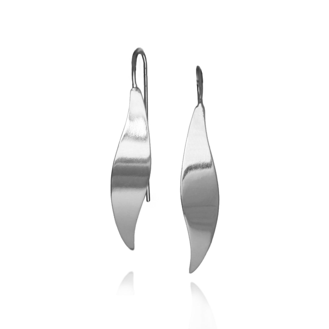 Pair of polished silver threader earrings on a white background