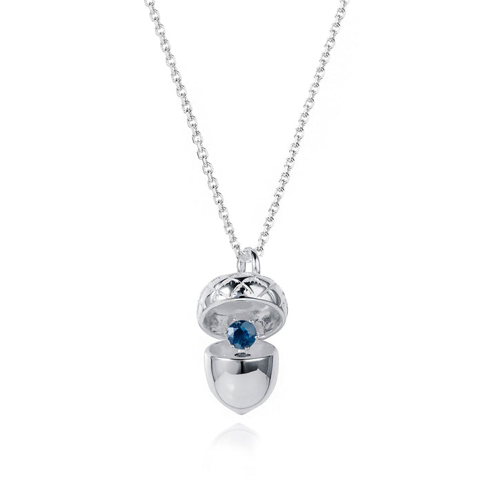 Sterling silver acorn locket pendant open showing sapphire September birthstone
