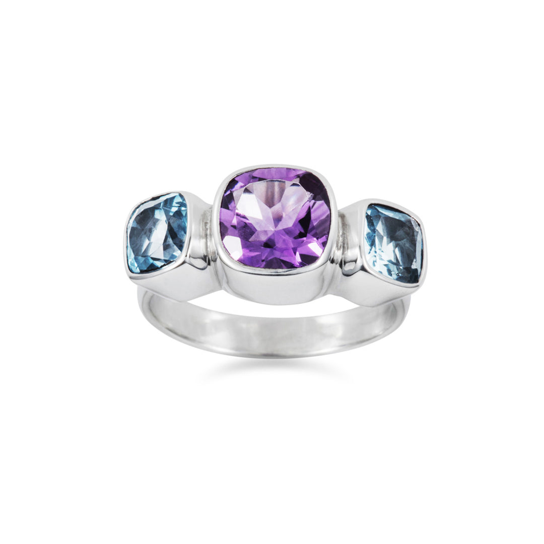 Front view of a silver ring with amethyst and blue topaz cushion-cut stones on a white background