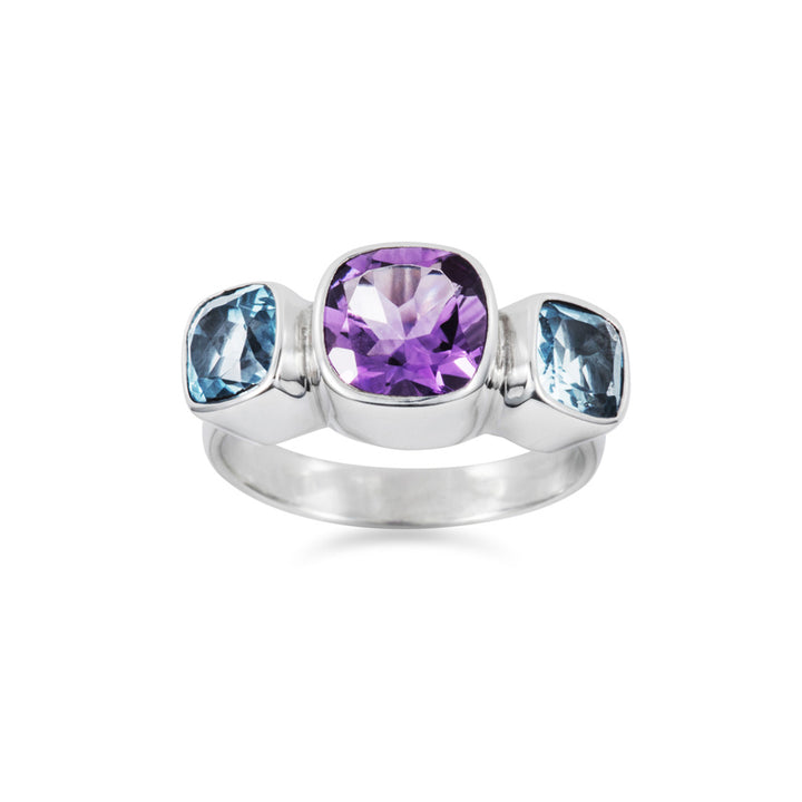 Front view of a silver ring with amethyst and blue topaz cushion-cut stones on a white background