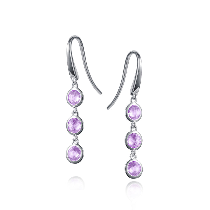 Silver drop earrings with three amethyst gemstones on a white background