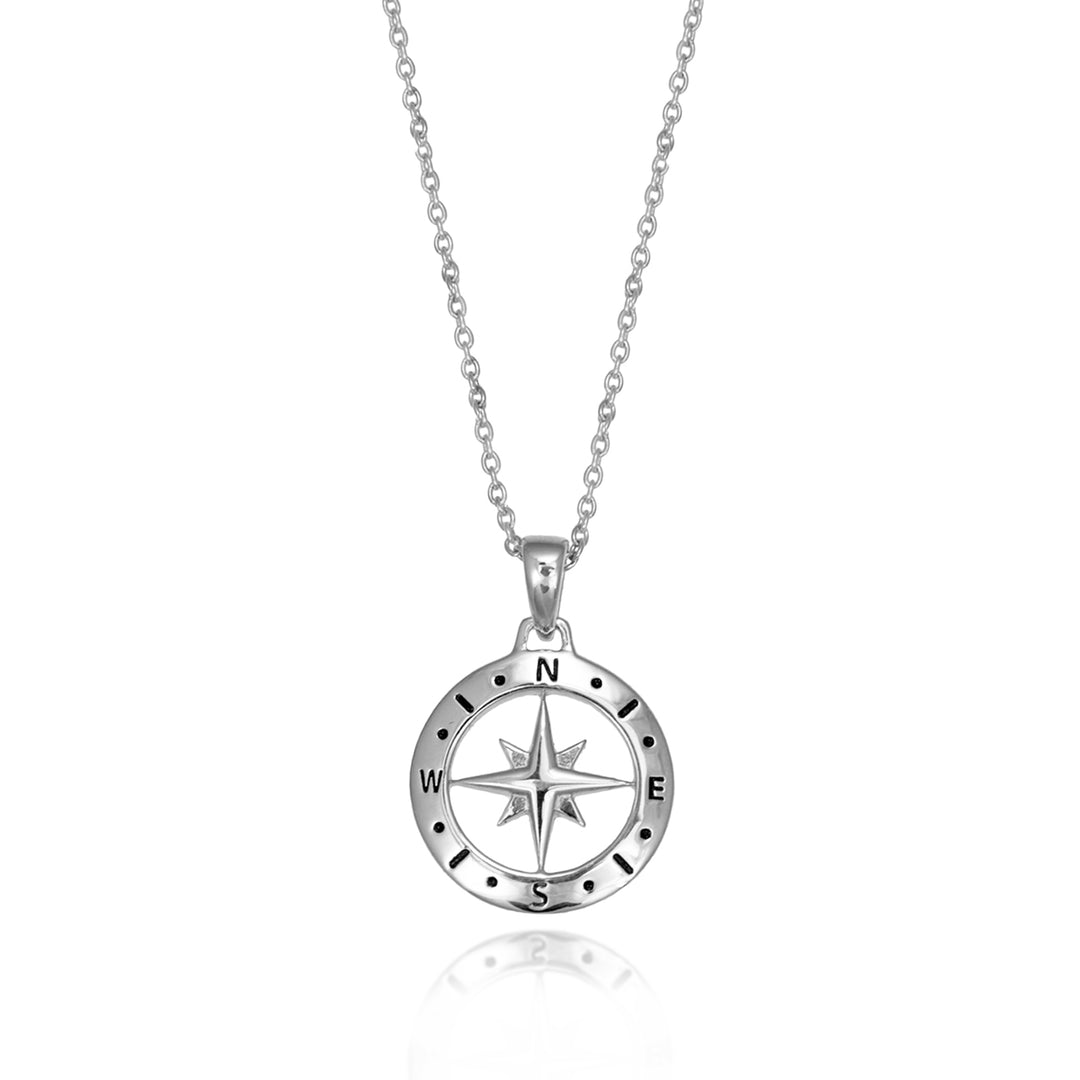 Silver compass necklace and chain against a white background