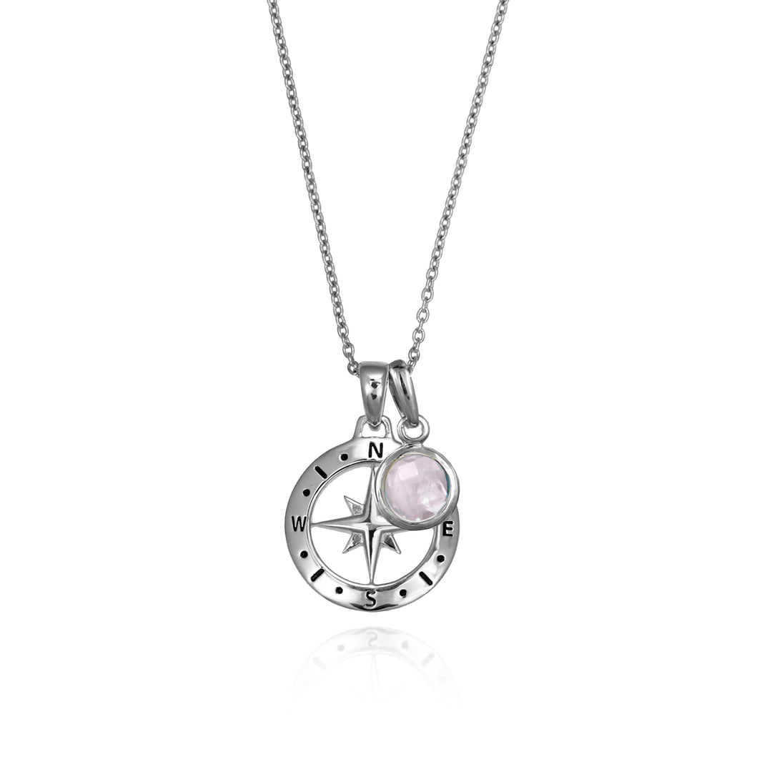 Silver compass necklace with a rose quartz october birthstone charm pendant and chain on a white background