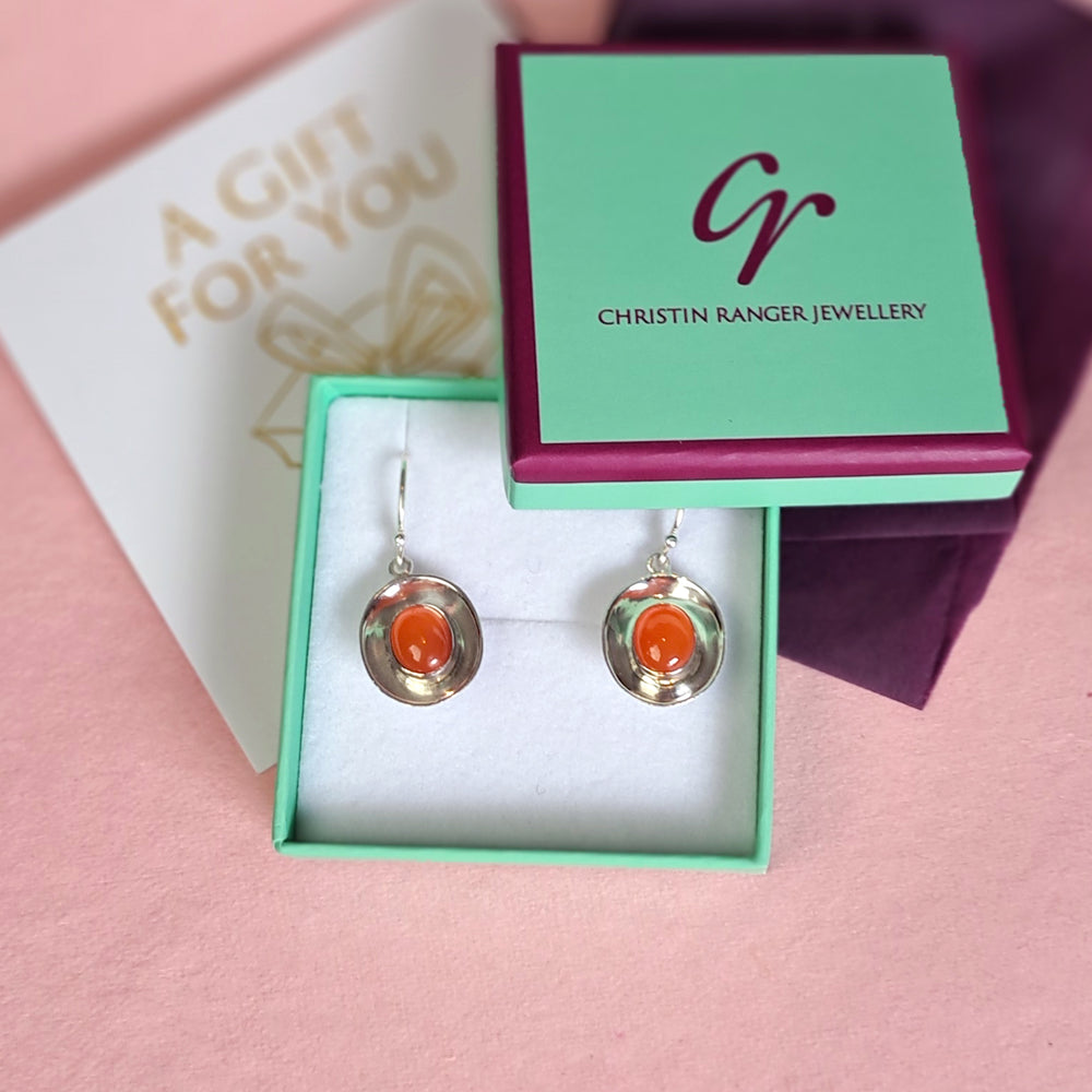 Sterling silver dish shaped drop earrings with carnelian in a Christin Ranger Jewellery gift box with card