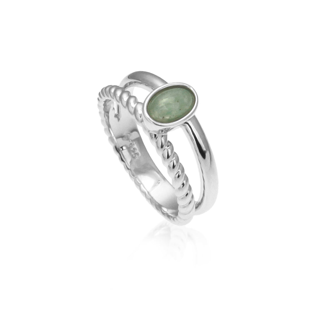 double banded silver ring set with a green aventurine cabochon stone on a white background