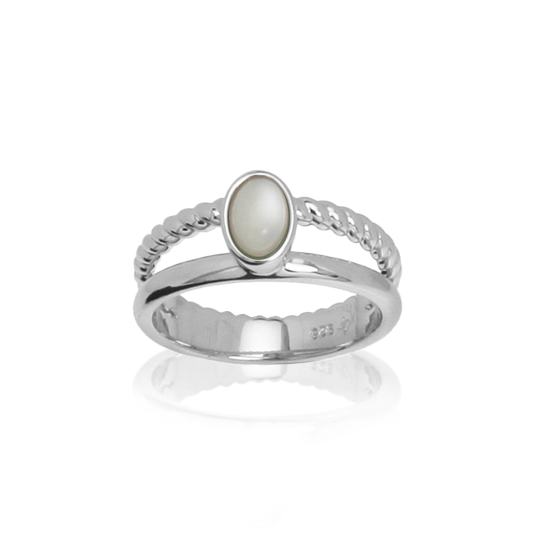 Front view of moonstone ring with two bands on a white background