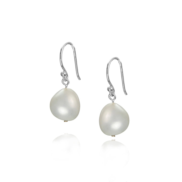 Pearl earrings with silver hooks on a white background