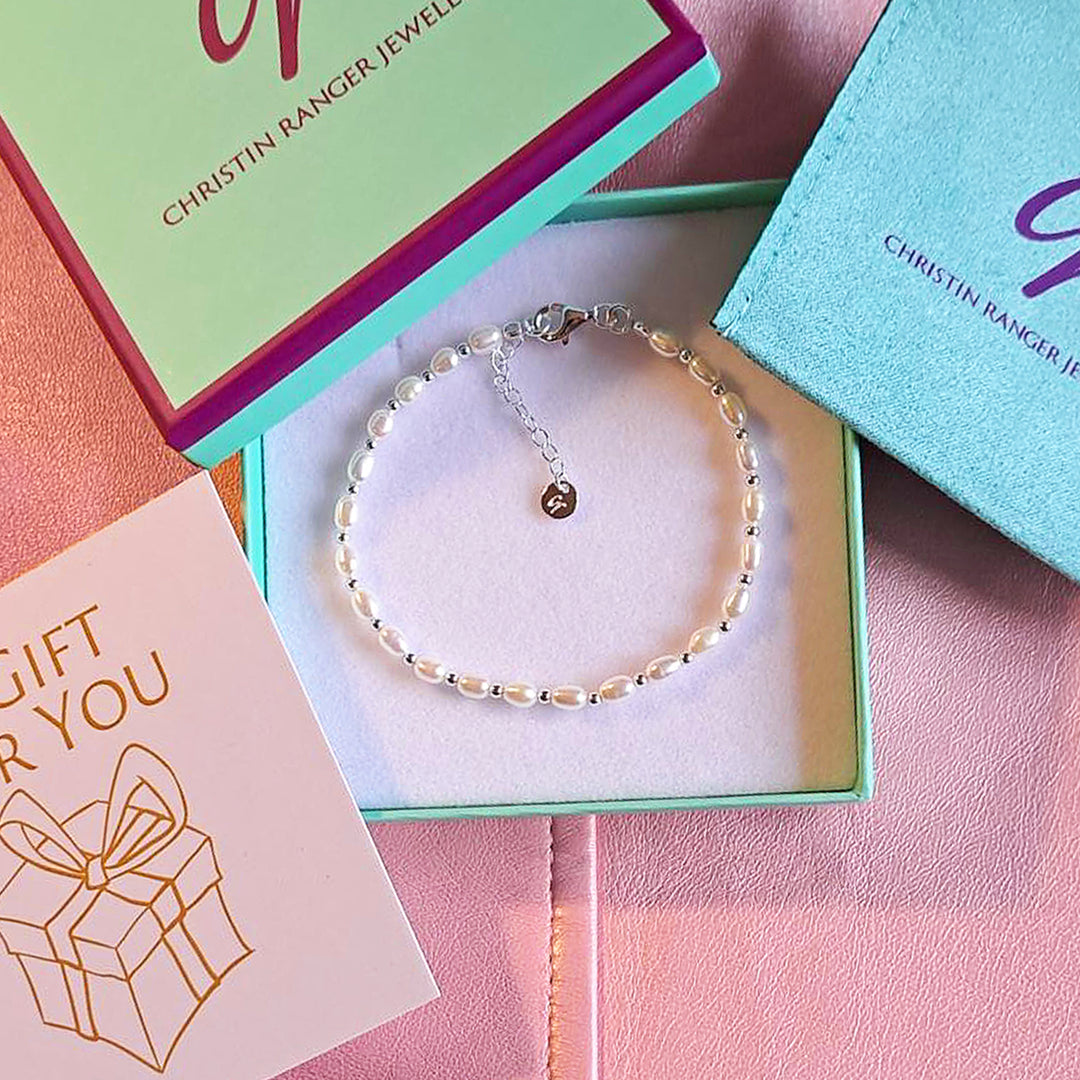 Pearl and silver bracelet in a Christin Ranger gift box and card