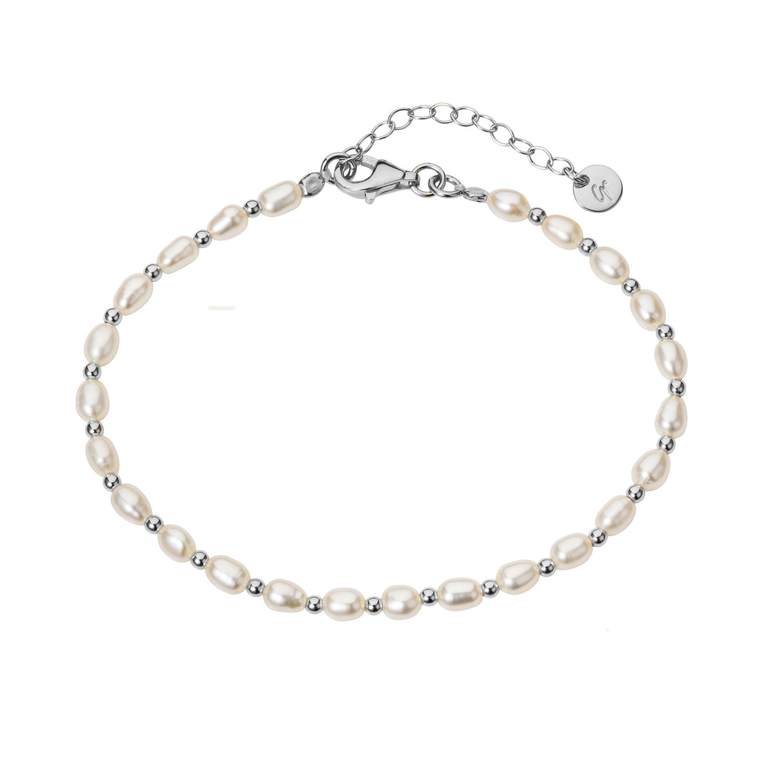 Pearl bracelet with silver beads on a white background