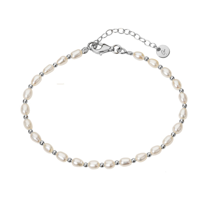 Pearl bracelet with silver beads on a white background