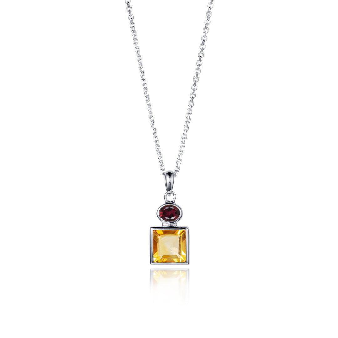 Silver necklace with a pendant featuring a square yellow citrine and red garnet on a white background