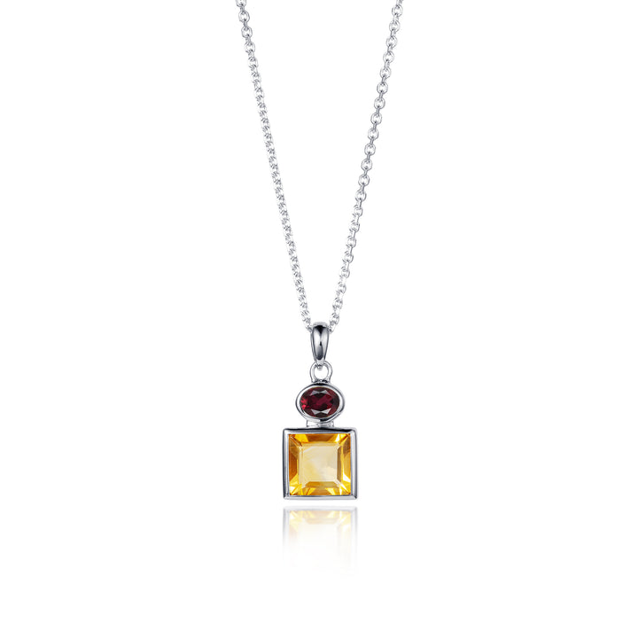 Silver necklace with a pendant featuring a square yellow citrine and red garnet on a white background