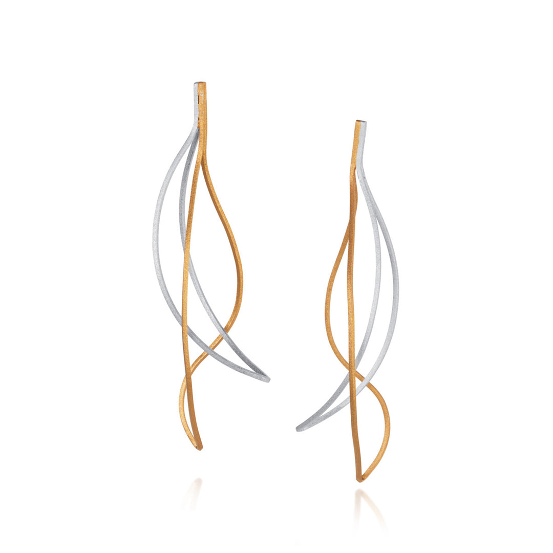 Pair of unique gold and silver post earrings on a white background