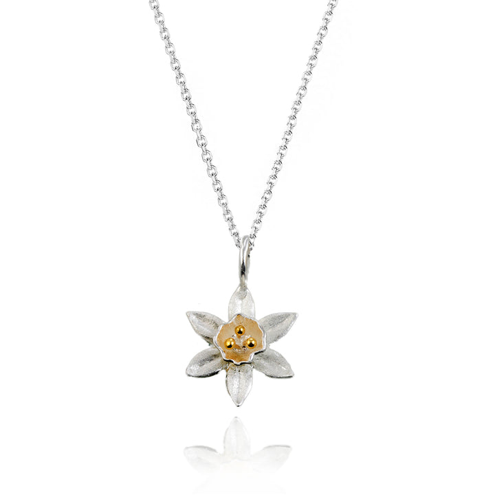 Sterling silver daffodill pendant and chain on a white background.
