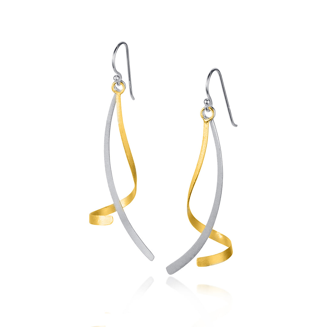 Pair of gold and silver twisted earrings on a white background