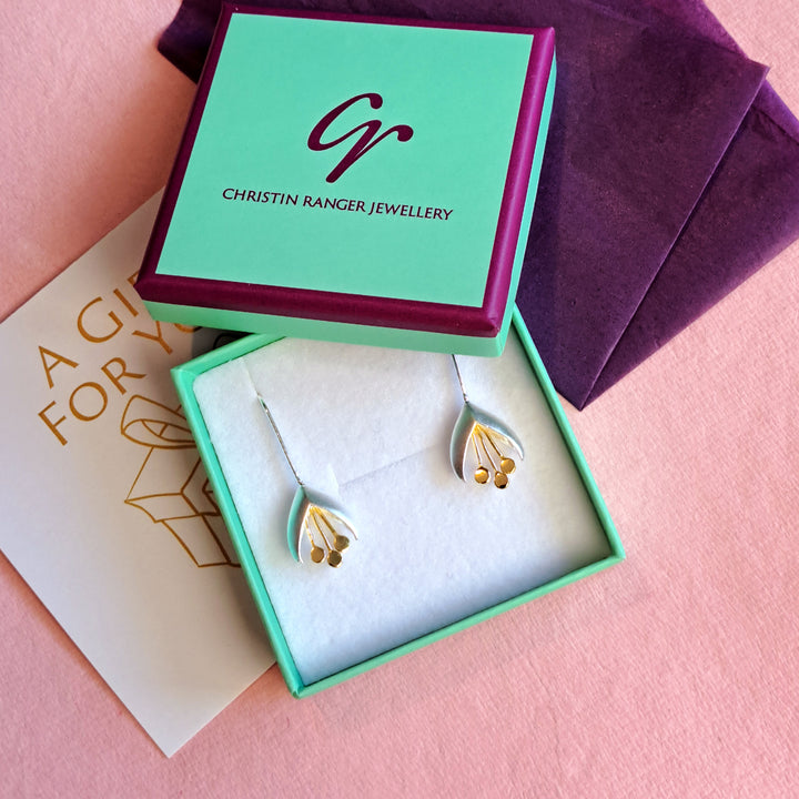 Sterling silver and gold snowdrop drop earrings in Christin Ranger Jewellery gift packaging