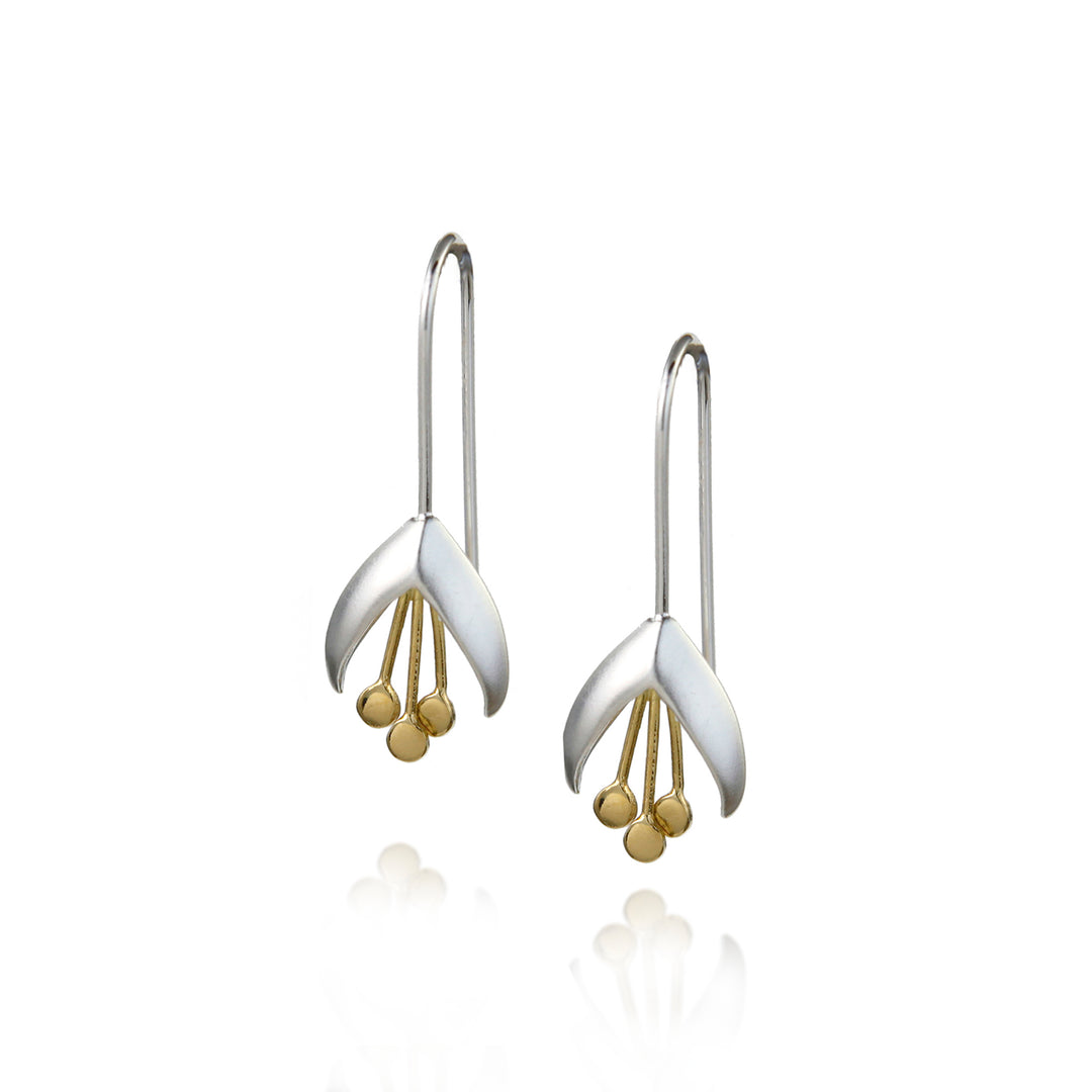Pair of silver snowdrop earrings with gold stamens on a white background