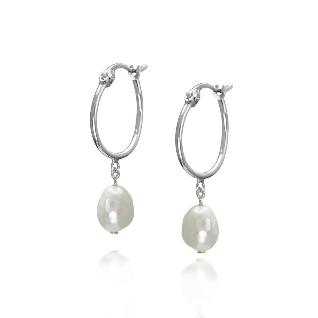 Silver hoop earrings with pearl drops on a white background