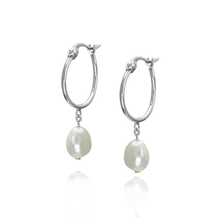 Silver hoop earrings with pearl drops on a white background