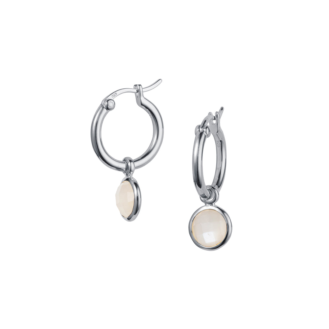 A pair of silver hoop earrings with snap posts and moonstone drops.