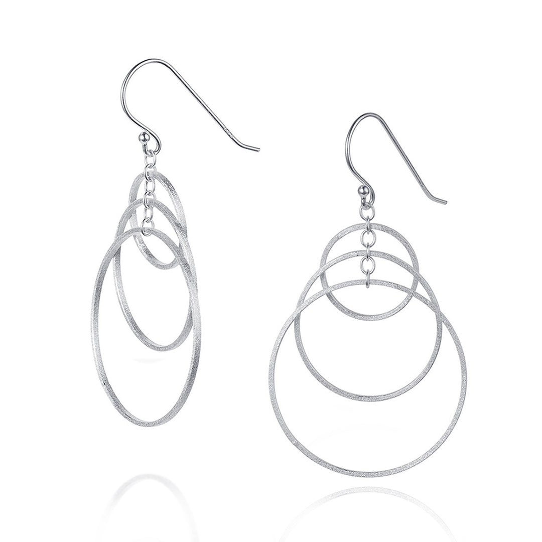 Silver hoop dangle earrings on a white background