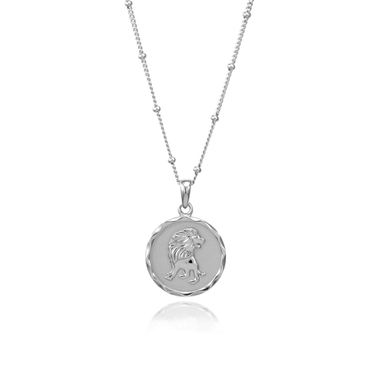 Silver Leo zodiac pendant with beaded chain on a white background