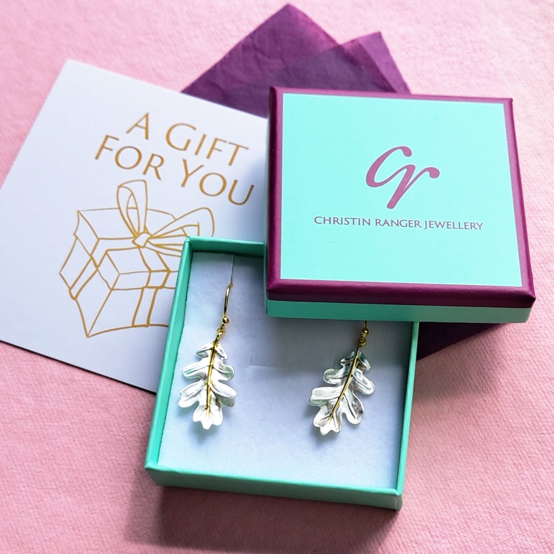 Sterling silver and gold vermeil oak leaf hook earrings in Christin Ranger gift packaging