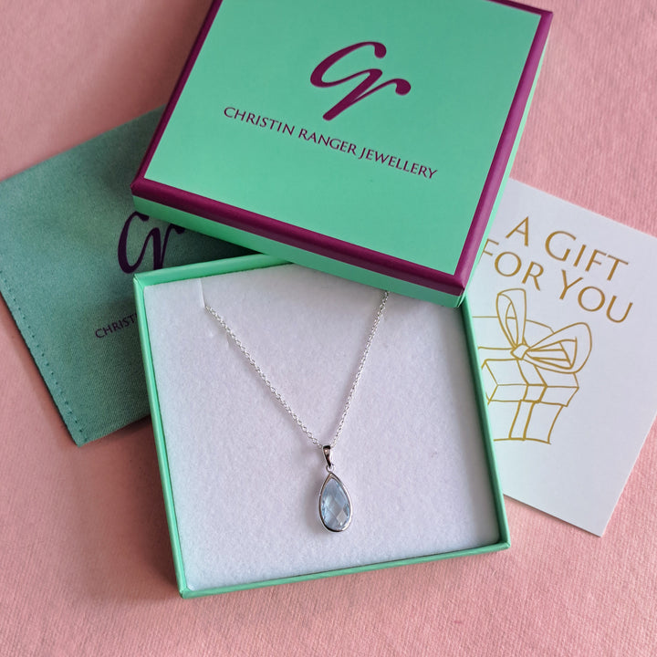 Sterling silver pear drop pendant necklace in blue topaz in Christin Ranger Jewellery gift packaging