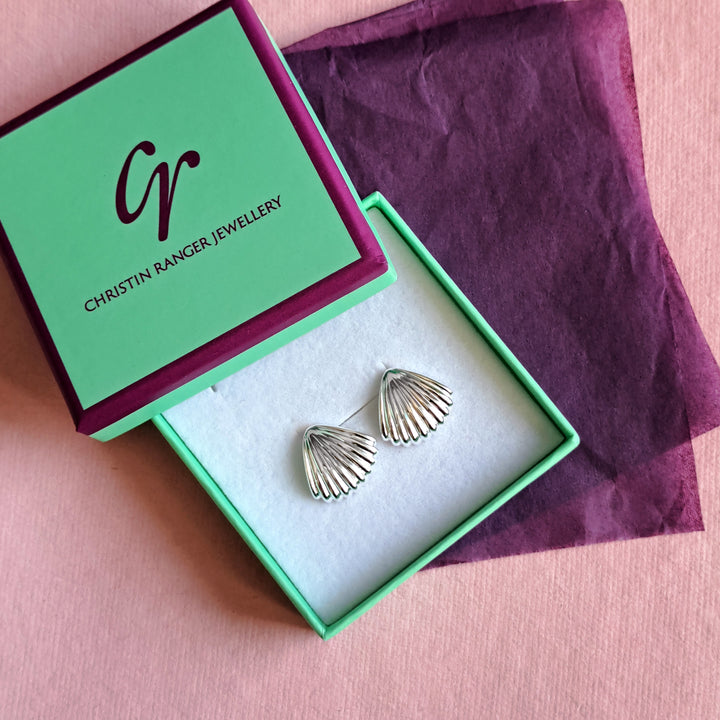 Sterling silver seashell stud earrings in Christin Ranger Jewellery gift packaging
