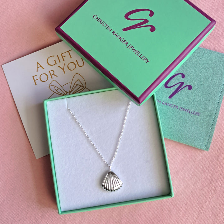 Sterling silver seashell clam pendant necklace in Christin Ranger Jewellery packaging