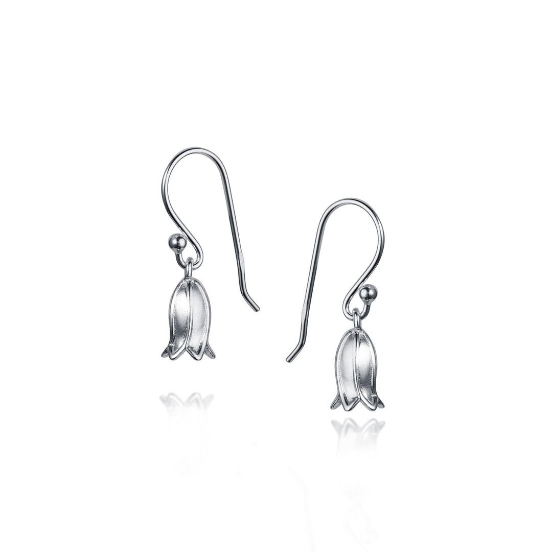 Silver bell-shaped earrings on a white background