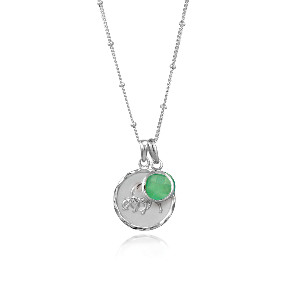 Silver Taurus Zodiac Pendant with a green quartz may birthstone charm on a white background