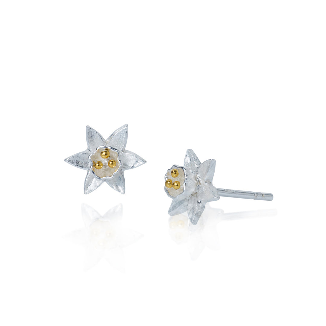 Pair of silver and gold daffodil-shaped earrings on a white background