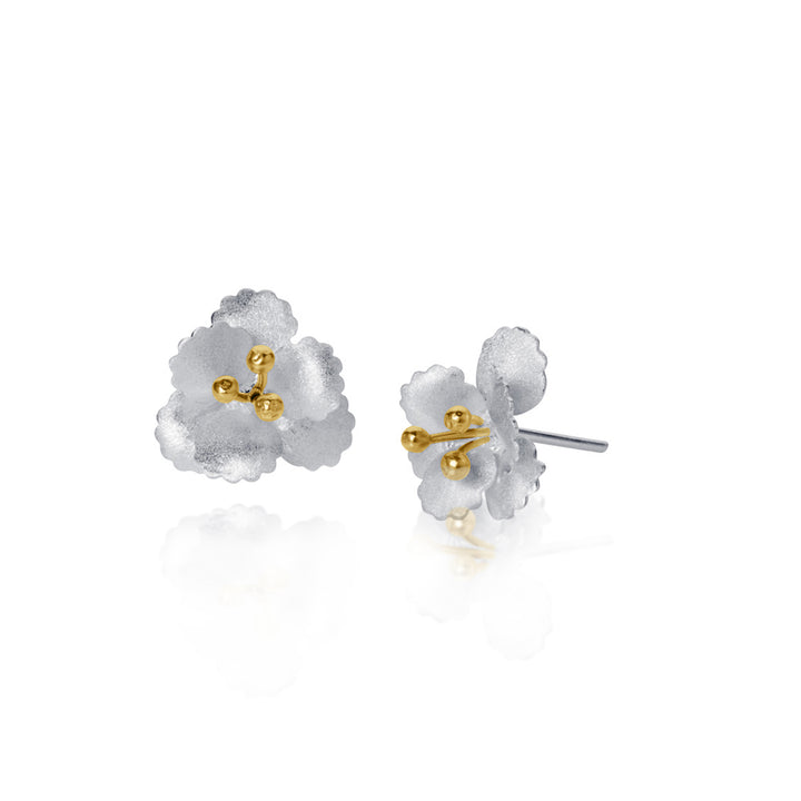 Flower-shaped earrings with gold centers on a white background