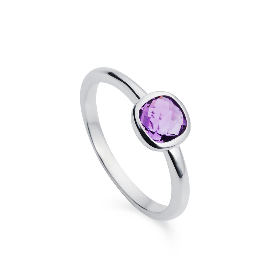 Silver solitaire ring with square amethyst gemstone on a white background